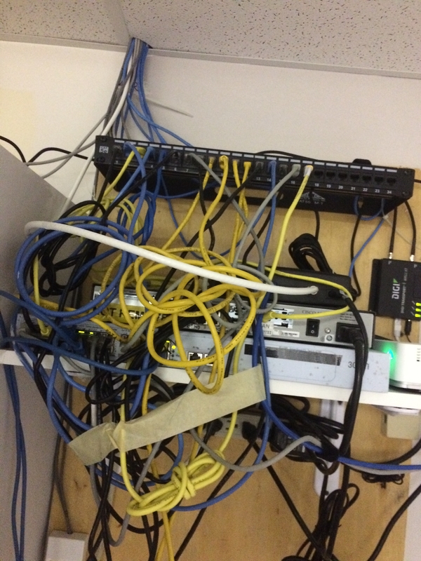 Tech Service Today IT Disaster of the week photo of network cables managed with masking tape