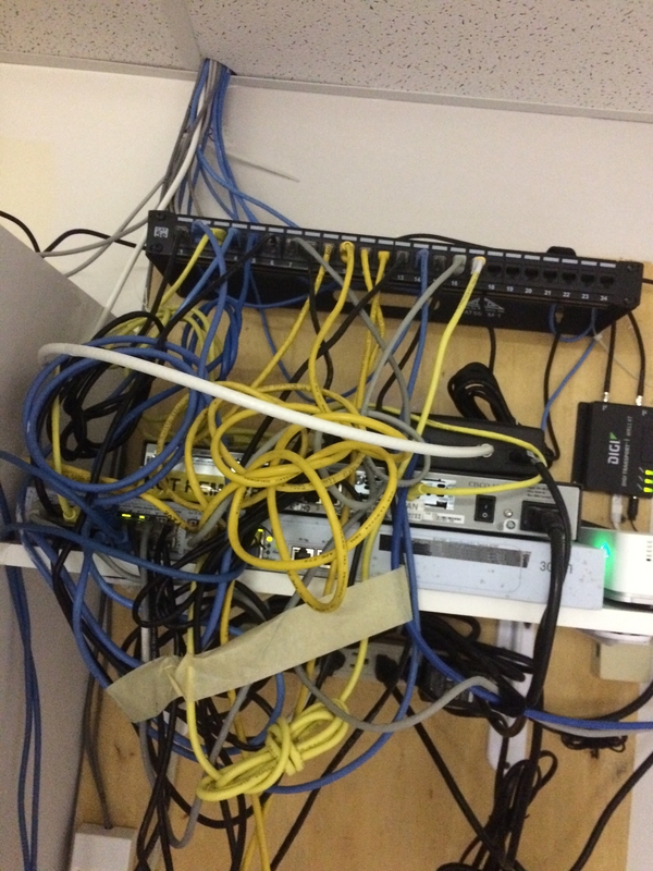 Tech Service Today IT Disaster of the week photo of network cables managed with masking tape